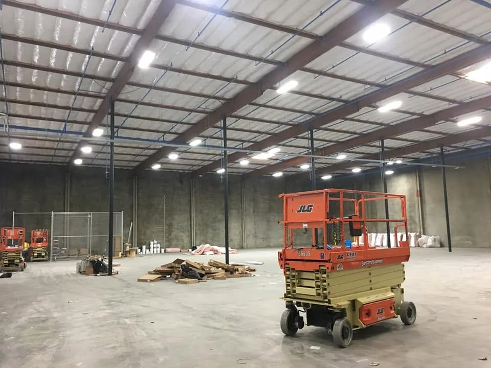 Row of commercial electrical panels with metallic conduit