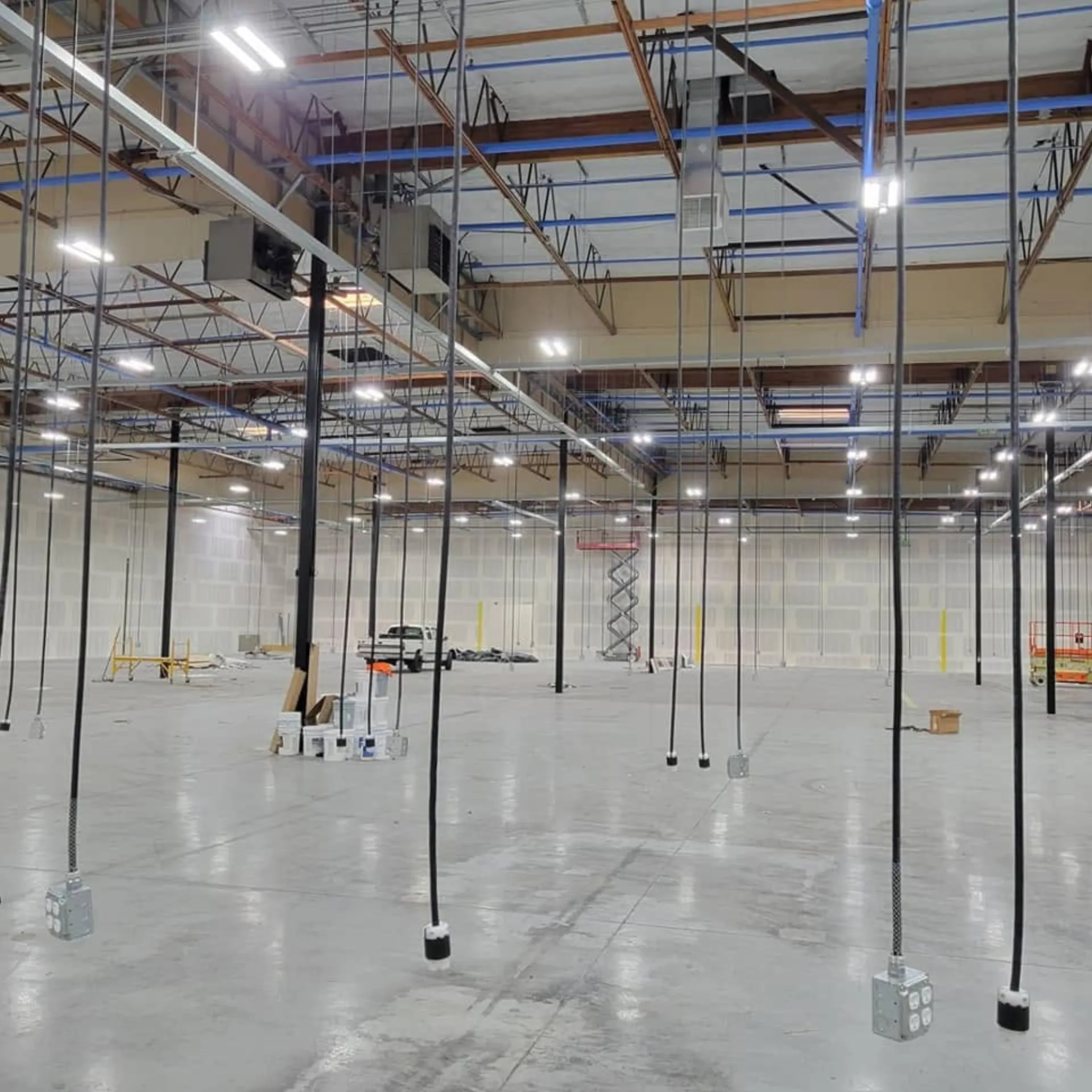 Overhead power and conduit installation on a commercial tenant improvement project